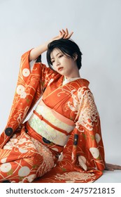 Portrait of young beautiful Asian woman wearing Kimono(Japanese traditional  clothes). Pre-shoot photo of Coming of Age Ceremony.