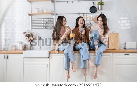 Portrait of young beautiful asian woman group of friends hands holding coffee cup morning time in kitchen room Happy cheerful relax in winter. Korean asian makeup wakeup university together lifestyle 
