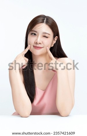 Portrait of young beautiful Asian woman with healthy facial skin in K-beauty make up isolated on white background.