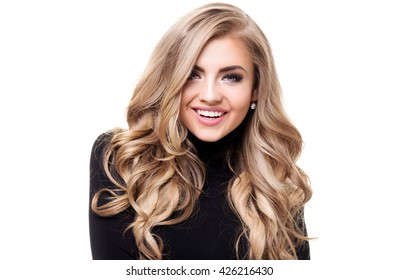 Portrait of young beautiful blonde woman with long curly hair and glamour makeup. Girl looking at camera. White background. Black and white style.