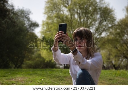 Similar – Image, Stock Photo funny twin sisters make a selfie with the smartphone