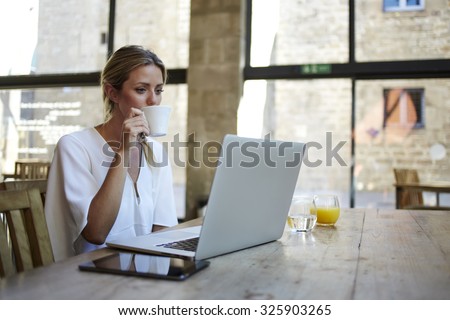 Similar – Image, Stock Photo Businesswoman enjoying coffee break in a modern cafeteria
