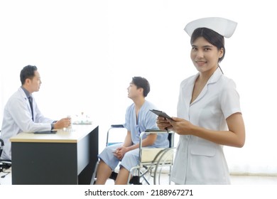 Portrait Of Young Beautiful Cheerful Female Nurse Smiling With Doctor And Patient Interaction Together On The Background. COPY SPACE.