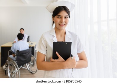 Portrait Of Young Beautiful Cheerful Nurse Smiling With Doctor And Patient Interaction Together Background