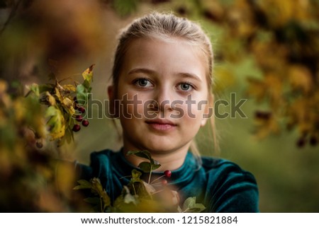 Similar – Foto Bild Herbstportrait eines glücklichen Kindes Mädchens im Garten sitzend