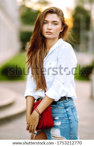 Similar – Image, Stock Photo smiling young woman leaning against a wall