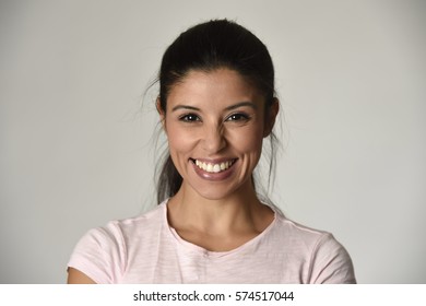 Portrait Of Young Beautiful And Happy Latin Woman With Big Toothy Smile Excited And Cheerful In Charming Face Expression Isolated Clear Grey Background In Female Happiness Emotion