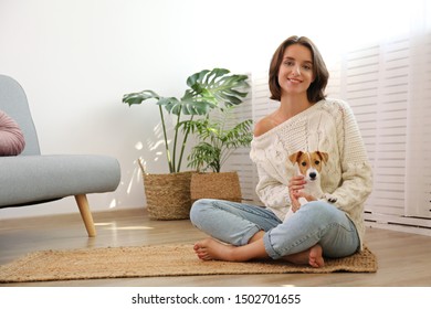 Portrait Of Young Beautiful Hipster Woman With Her Adorable Four Months Old Jack Russell Terrier Puppy At Home In Living Room Full Of Natural Sunlight. Lofty Interior Background, Close Up, Copy Space.