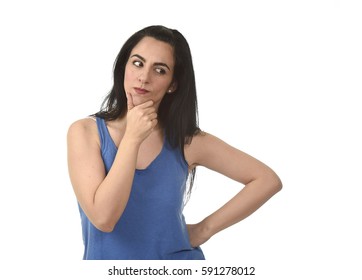 Portrait Of Young Beautiful Hispanic Woman Thinking And Wondering Looking Thoughtful As If Considering Options Isolated On White Background