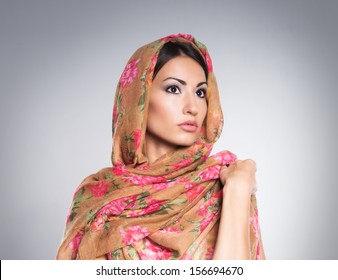 Portrait of young and beautiful orthodox woman wearing scarf on her head
