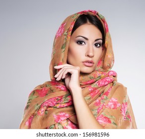 Portrait of young and beautiful orthodox woman wearing scarf on her head