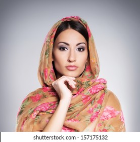 Portrait of young and beautiful orthodox woman wearing scarf on her head