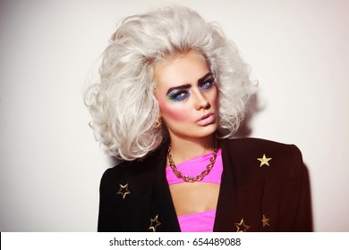 Portrait Of Young Beautiful Platinum Blond Woman With Bold Eyebrows And 80s Style Makeup