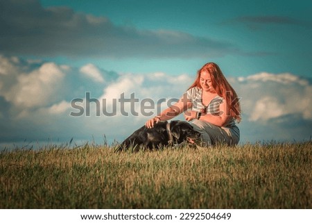 Similar – Image, Stock Photo Blond woman walking her dogs at sunset