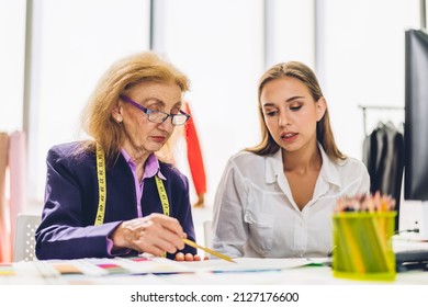 Portrait Of Young Beautiful Pretty Owner Business Woman Fashion Designer Stylish Sitting And Working.Attractive Senior Woman Designer Working With Sewing Machine And Colorful Fabrics At Fashion Studio