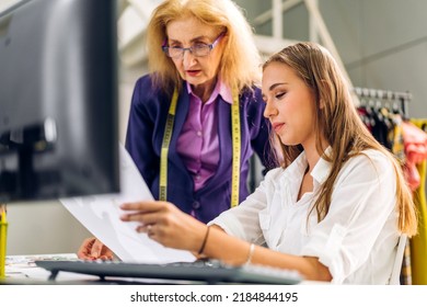 Portrait Of Young Beautiful Pretty Owner Business Woman Fashion Designer Stylish Sitting And Working.Attractive Senior Woman Designer Working With Laptop And Colorful Fabrics At Fashion Studio