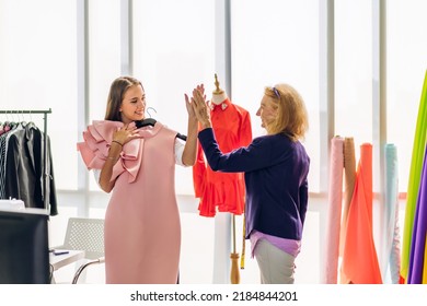 Portrait Of Young Beautiful Pretty Owner Business Woman Fashion Designer Stylish Sitting And Working.Attractive Senior Woman Designer Working With Colorful Fabrics At Fashion Design Workshop Studio