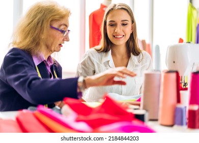 Portrait Of Young Beautiful Pretty Owner Business Woman Fashion Designer Stylish Sitting And Working.Attractive Senior Woman Designer Working With Sewing Machine And Colorful Fabrics At Fashion Studio