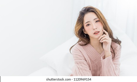 Portrait Young Beautiful Sexy Asian Woman Relax In Bedroom. Smile Happy Face Asian Girl On White Background. Beauty Treatment Perfect Clear Skin Japanese Korean Makeup Lifestyle Cold Winter Concept