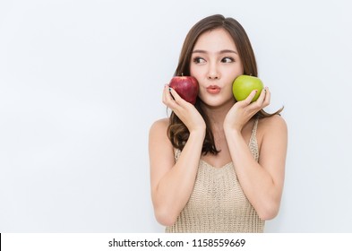 Portrait Of Young Beautiful Sexy Asian Girl With Hands Holding Green And Red Apple Food That Made Her Strong And Healthy, Vegetarian Woman Isolated On White Background Healthcare And Medical Concept.