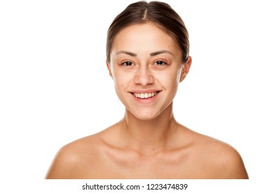 Portrait Of Young Beautiful Smiling Woman With No Makeup On White Background