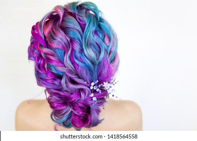 Portrait young beautiful woman and colored hair  Bright shades blue   purple  gradient hair  Elegant hairstyle in the hairstyle salon