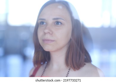 Portrait Of Young Beautiful Woman Considering Showcase In Shopping Center. Concept Of Shopping, Dream, Desire