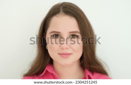 Portrait of young beautiful woman with dark long hair