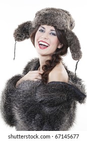 Portrait Of Young Beautiful Woman In A Fur Coat And Hat