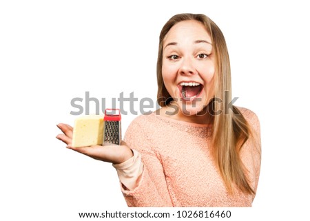 Portrait of young beautiful woman holds the grater. Isolated on white background