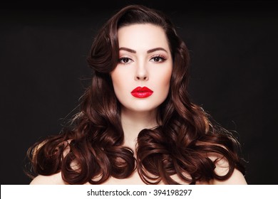 Portrait Of Young Beautiful Woman With Long Curly Hair And Red Lipstick