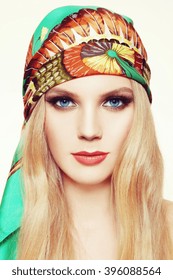 Portrait Of Young Beautiful Woman With Long Hair And Stylish Smoky Eyes Make-up In Green Silk Scarf