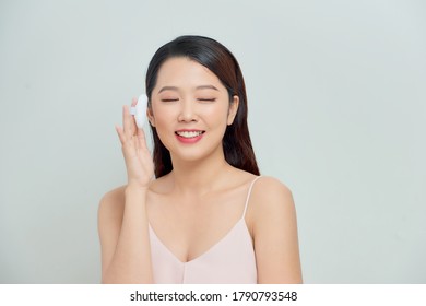 Portrait Of Young Beautiful Woman With Powder Puff. Girl Applying Makeup.