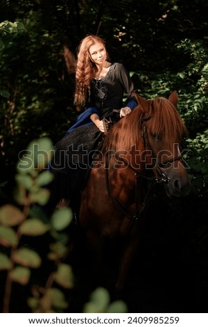 Portrait of young beautiful woman riding brown horse