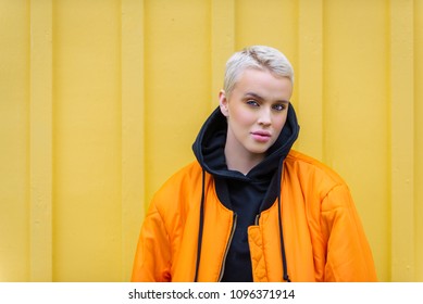 Portrait of young beautiful woman with short hairs - Influencer posing for a fashion advertising campaign - Powered by Shutterstock