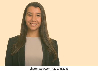 Portrait of young beautiful woman shot against studio background - Shutterstock ID 2110852133