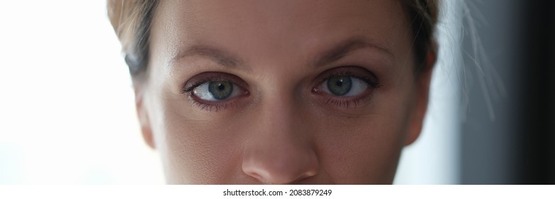 Portrait Of Young Beautiful Woman With Squint Eyes