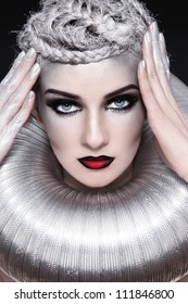 Portrait of young beautiful woman with stylish fancy make-up and silver hair