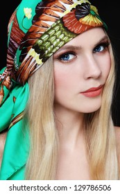 Portrait Of Young Beautiful Woman With Stylish Make-up And Colorful Scarf On Her Head