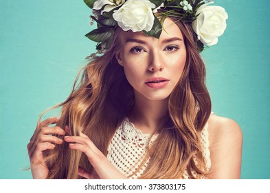 A Portrait Of A Young Beautiful Woman With White Flowers On The Head. Spring Fashion Photo