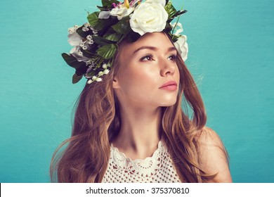 A Portrait Of A Young Beautiful Woman With White Flowers On The Head. Spring Fashion Photo