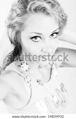 Portrait of young beauty woman in clothes at white background