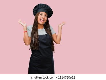 Portrait Of A Young Black Baker Woman Laughing And Having Fun, Being Relaxed And Cheerful, Feels Confident And Successful