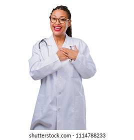 Portrait Of A Young Black Doctor Woman Doing A Romantic Gesture, In Love With Someone Or Showing Affection For Some Friend