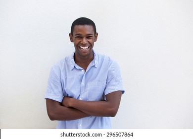 Portrait of a young black guy laughing on isolated white background