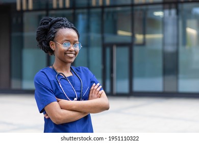 Portrait Young  Black Lady Doctor With Stethoscope With Glasses, Trendy African American Woman With Dreadlocks, Uniform, Smiling Afro Girl Medical Student  At College, University, Hospital, Clinic