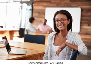 Portrait of young black woman in creative office