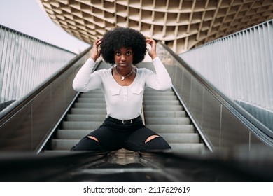 Portrait Of A Young Black Woman Getting Her Hair Done In The Street