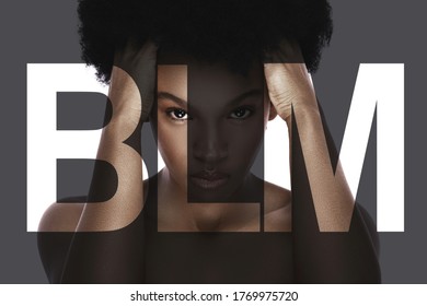 Portrait of young black woman with a lettering BLM. Concept of stopping racism and discrimination.