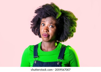 Portrait young black woman looking perplexed and confused isolated background